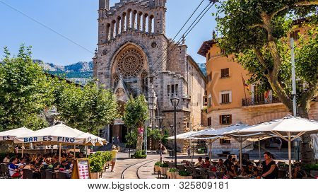 Soller, Mallorca, Spain, July 2015 St Bartholomew Church And City Square With Vintage Tramline And R