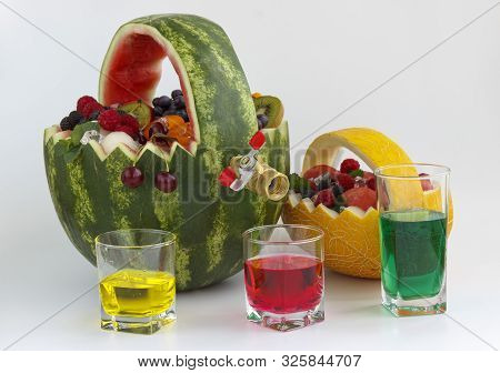 Fruit Basket And Juice Drain Tap. The Basket Is Made Of Watermelon And Filled With Different Fruits