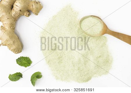 Top View Of Green Tea Matcha Isolated On White Background In A Wooden Spoon Near A Pile Of Tea, Next