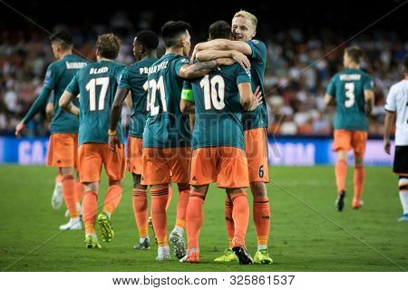 VALENCIA, SPAIN - OCTUBER 2: Ajax players celebratong goal during UEFA Champions League match between Valencia CF and AFC Ajax at Mestalla Stadium on Octuber 2, 2019 in Valencia, Spain