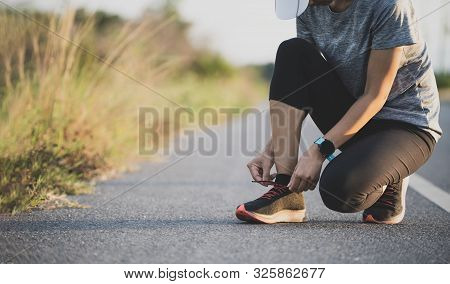 Running Shoes Runner Woman Tying Laces For Autumn Run In Forest Park. Runner Trying Running Shoes Ge