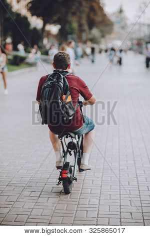 Man On  Solowheel, Electric Scooter, Kick Scooter, Bike Rides On Kiev City Streets. Modern Electric 
