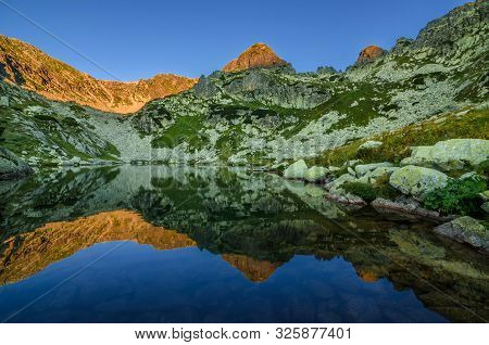 Mountain Landscape And Glacial Taul Portii Lake In Retezat National Park, Carpathian Mountains, Roma