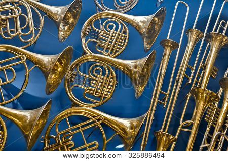 Background Of Repeating Brass Instruments. French Horns, Trumbets