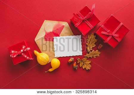 Greeting Card And Autumn Frame Of Oak And Sceleton Leaves, Red Gift Boxes, Envelop, Acorns And Two S