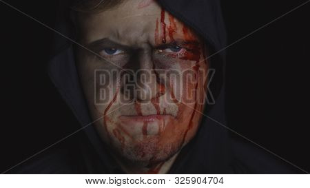 Executioner Halloween Man Portrait. Guy With Dripping Blood On His Face. Executioner, Headman Makeup