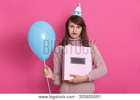 Close Up Portrait Of Young Beautyful Darkhaired Woman With Gift And Blue Balloon Posing Isolated Ove