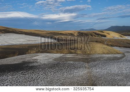 Colorful Rhyolit Mountain Panorma With Snow Fiields And Multicolored Volcanos In Landmannalaugar Are