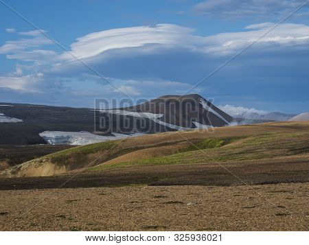 Colorful Rhyolit Mountain Panorma With Snow Fiields And Multicolored Volcanos In Landmannalaugar Are