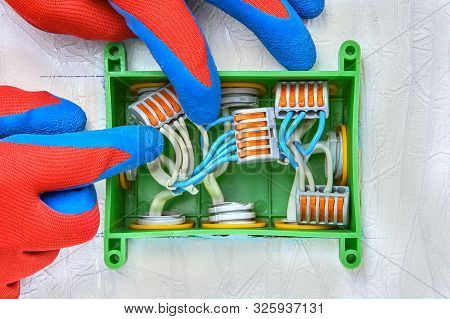 Electrical Work. An Electrical Terminal Block With Push Lever, Used To Connect And Extend The Wires 