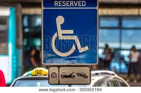 Bucharest, Romania - July 15, 2019: A Reserved Handicapped Parking Sign (reserved Disabled Parking S