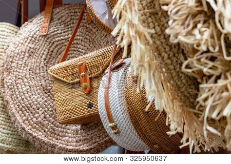 Balinese Traditional Handmade Rattan Woven Round Shoulder Bags With Leather Handles At A Souvenir St