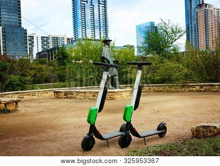 Austin, Texas, November 5, 2018. Downtown Austin, Texas,  Scooters In Front Of Stevie Vaughan  Statu
