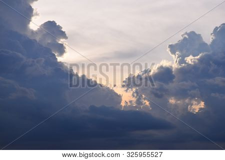 Sun Rise And Sun Set Background, Yellow, Black And Orange Clouds In The Sky.
