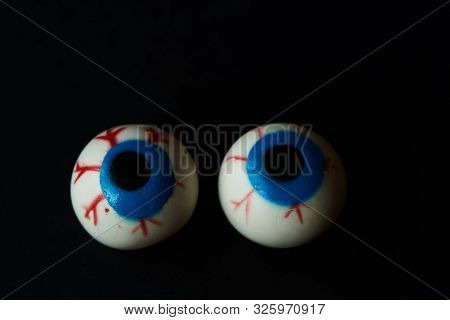 Two Hallloween Scary Eyeballs On Black Background