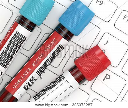 3d Render Of Cbc Blood Tubes Lying On Computer Keyboard