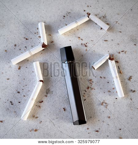Single Vape Pen Type Electronic Cigarette As Smoking Alternative With Broken Cigarettes And Scattere
