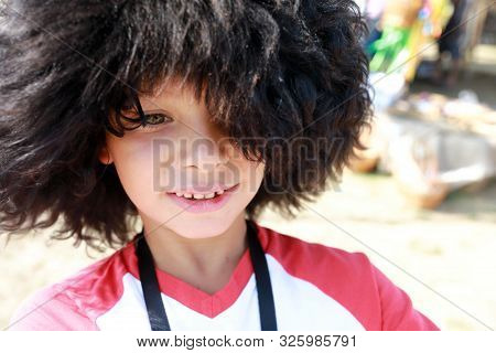Portrait Of Boy In Russian Papakha Hat