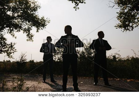 Silhouette Of Tree Man In Suit Outside