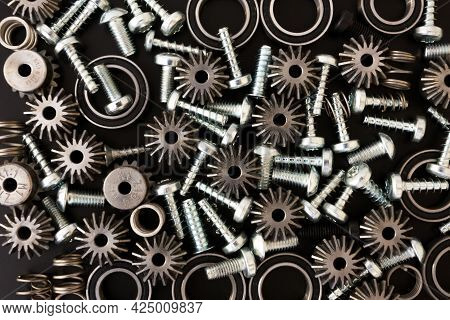 Background With Mechanical Components, Gears, Springs, Screws, Industrial Objects