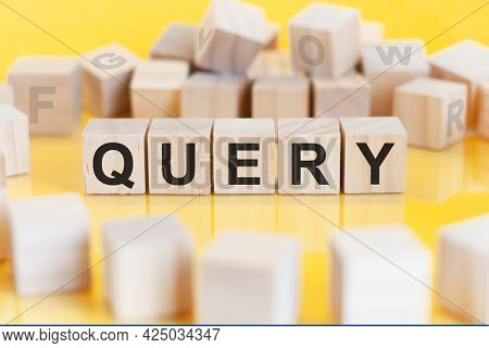The Word Query Is Written On A Wooden Cubes Structure. Blocks On A Bright Background. Financial Conc