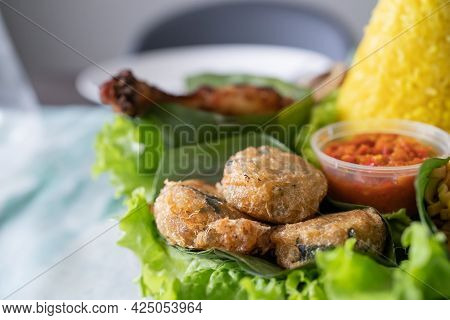 Nasi Tumpeng. Indonesian Cuisine Yellow Rice On Banana Leaf