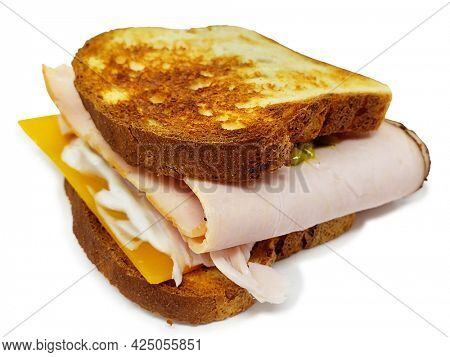 Toasted Turkey and Cheese Sandwhich on Gluten Free Bread with clipping path over white background.