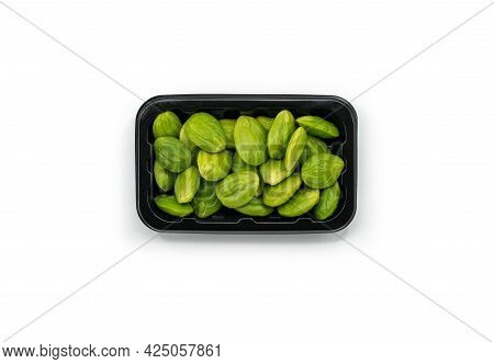 Top View Fresh Bitter Beans In A Plastic Black Tray For Sale On White Background, Bitter Beans Or Sa