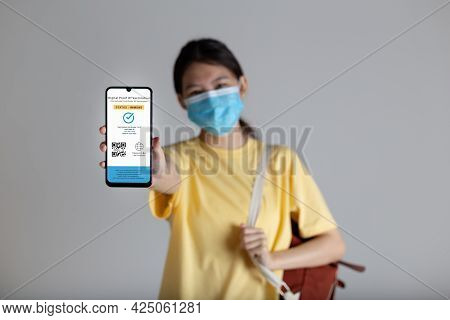 Vaccine Passport, Woman Holding Smartphone Showing Health Passport Of Vaccination Certification, Sta