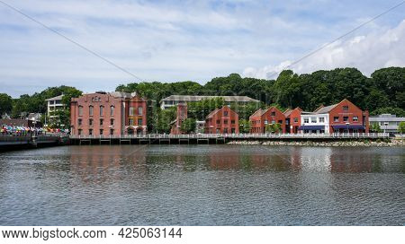 WESTPORT, CT, USA - JUNE 26, 2021:  Red brick buildings near Saugatuckriver with bridge near downtown in nise cummer day