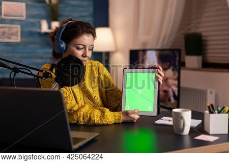Influencer Holding Tablet With Green Screen Display Recording New Podcast Series For Audience. Broad