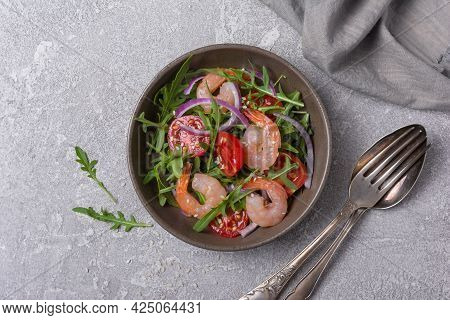 Healthy Salad With Fresh Arugula, Cherry Tomatoes, Tasty Shrimps And Onion