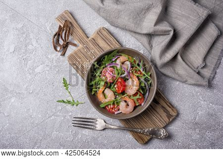 Healthy Salad With Fresh Arugula, Cherry Tomatoes, Tasty Shrimps And Onion