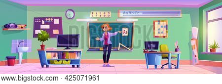 Educator Standing By Chalkboard Explaining Material Of Lesson. Education And Obtaining Knowledge In 