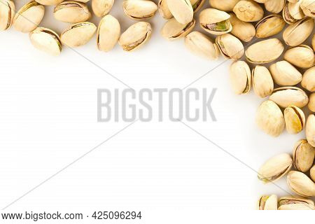 Border Of Salted, Roasted Green Pistachio Nuts Snack On White Background, Healthy Food Snack, Copy S