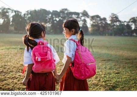 Primary School Student Friend Wearing Indonesian Uniform Going To School