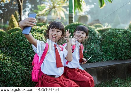Best Friend Of Indonesian Primary School Student Take Selfie