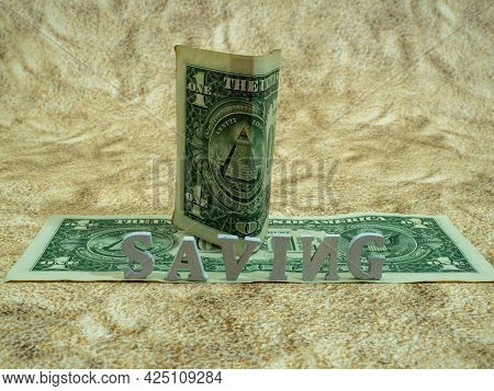 The Dollar Is On The Dollar. Sand Background.