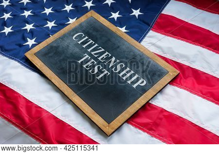 Citizenship Test On The Blackboard And Usa Flag.