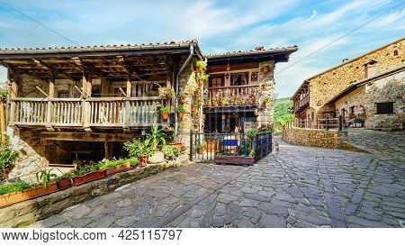 Panoramic View Of An Old Town With Stone Houses, Wooden Balconies And Cobbled Streets. Barcena Mayor