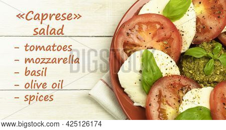 Caprese Salad In A Plate Over Wooden Background. Fresh Tomato And Mozzarella Cheese With Basil Leave