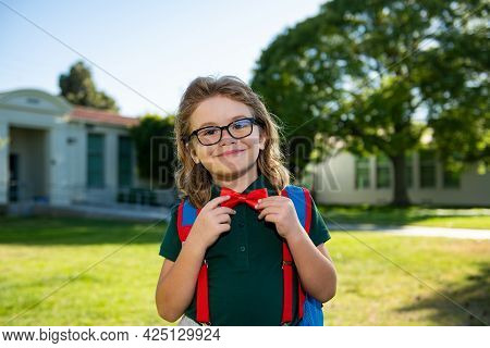 Back To School And Schooling. Little Schoolboy Pupil Back To School At Knowledge Day.