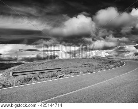 Beautiful scenic view in a rainy and cloudy day over the Transalpina road, the highest mountain road in the Carpathians located in the Parang mountains, Romania, Europe