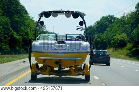 Bowling Green, Kentucky, U.s.a - June 16, 2021 - A Truck Towing A Boat On The Highway Interstate 65