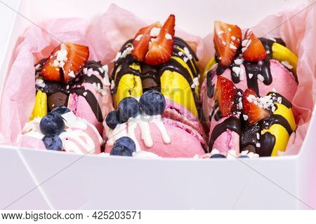 Traditional French Macaroons With Bluebarry And Strawberry. Colourful And Delicious Dessert With Cho