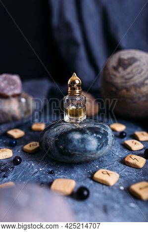 Small Glass Bottle With Natural Magic Oil. Cosmetic And Magic Elixir.