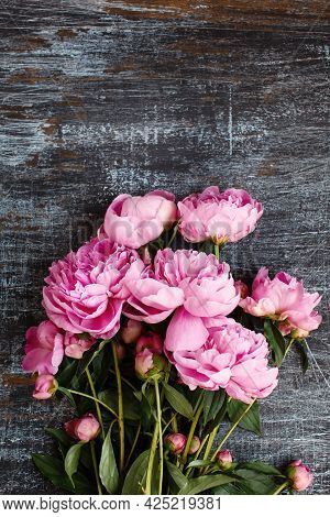 Fluffy Bouquet Of Pink Fresh Peony Flowers On Scratched Shabby Dark Wood, Flat Lay