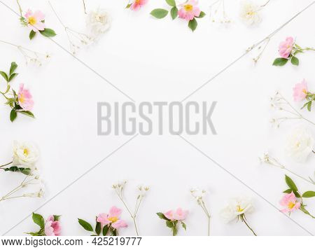 Festive Flower Wildrose Composition On The White Background. Overhead Top View, Flat Lay. Copy Space