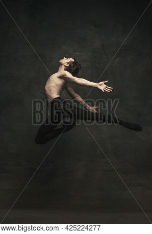 Young And Graceful Male Ballet Dancer Isolated On Dark Background. Art, Action, Inspiration Concept.