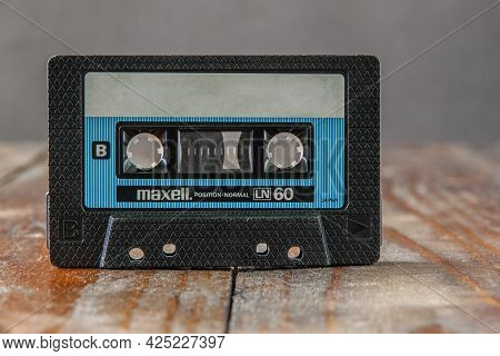Krasnodar, Russia - March 11, 2021: A Black, Slightly Dusty Maxell Audio Cassette Stands Against A B